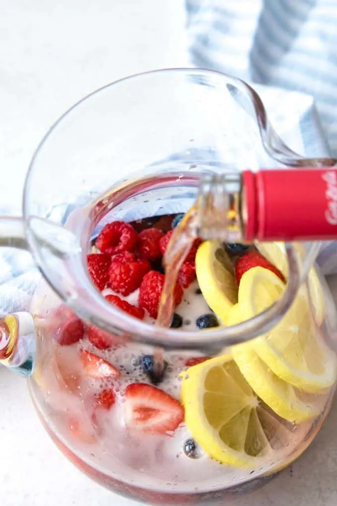 rosé being poured into a pitcher