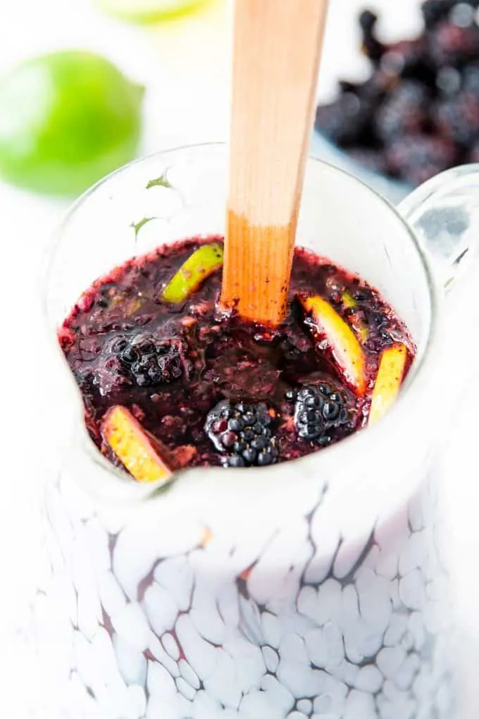 blackberry sangria in an etched white pitcher