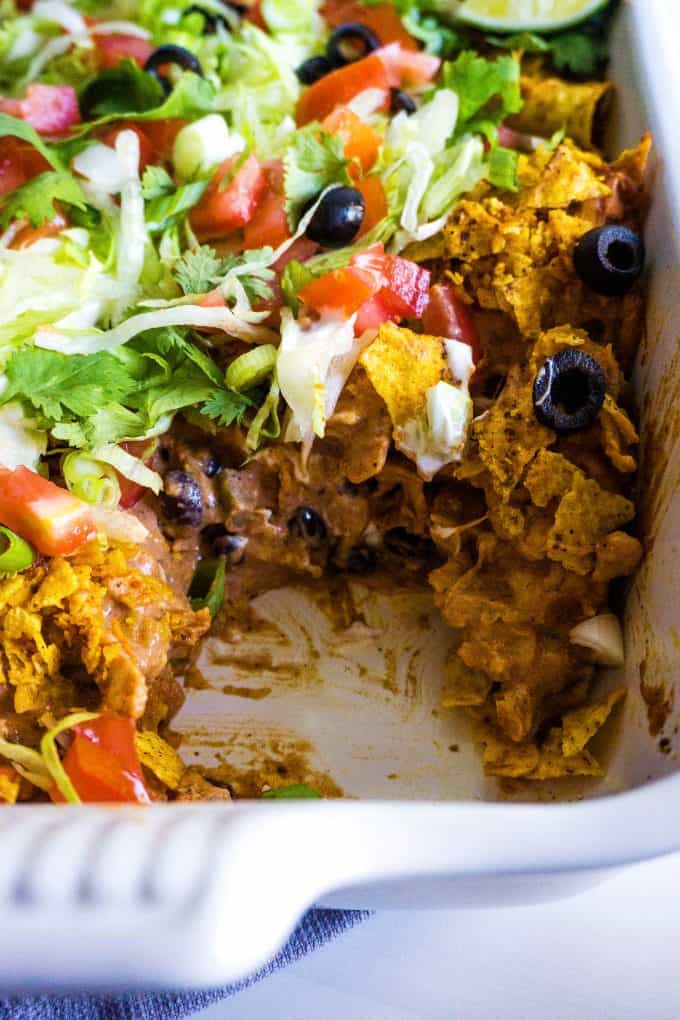 chicken taco casserole in a white casserole dish