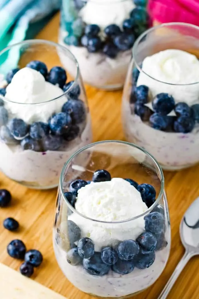no bake blueberry cheesecake in 4 stemless wine glasses