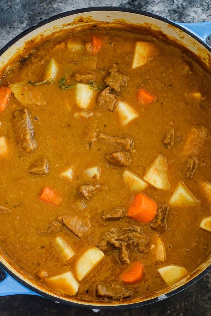 beef pumpkin stew in a blue dutch oven