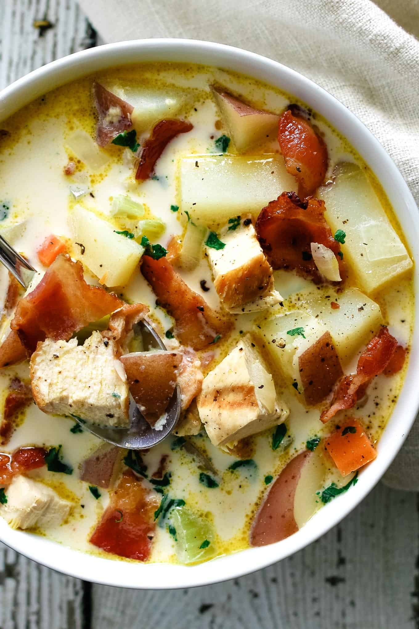 white bowl filled with chicken potato chowder