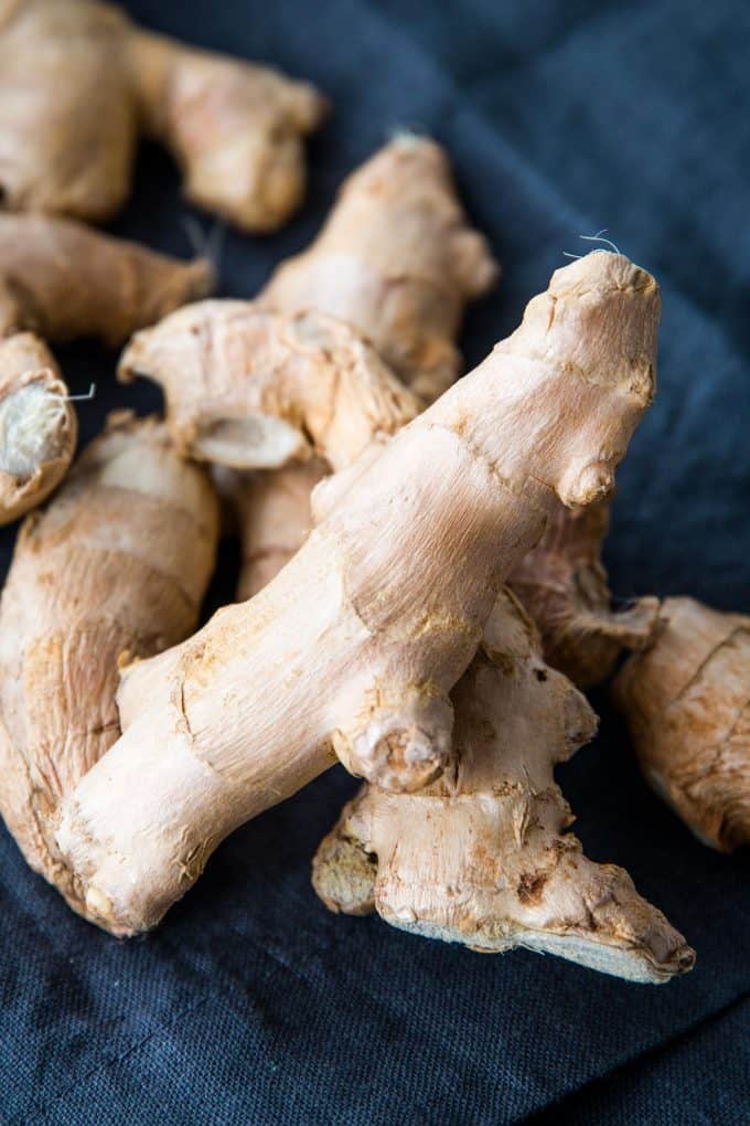 fresh ginger on a dark blue napkin