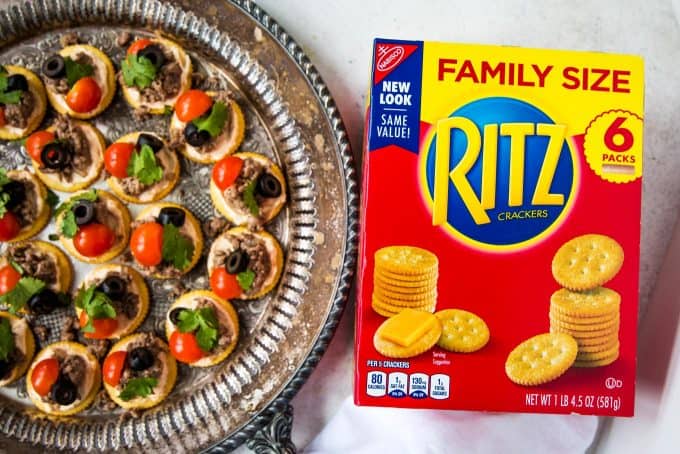 RITZ crackers in the family size box next to a tray of RITZ taco bites