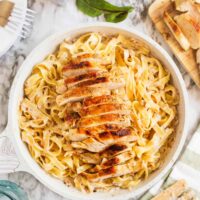 creamy chicken tagliatelle in a white pan