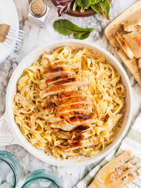 creamy chicken tagliatelle in a white pan