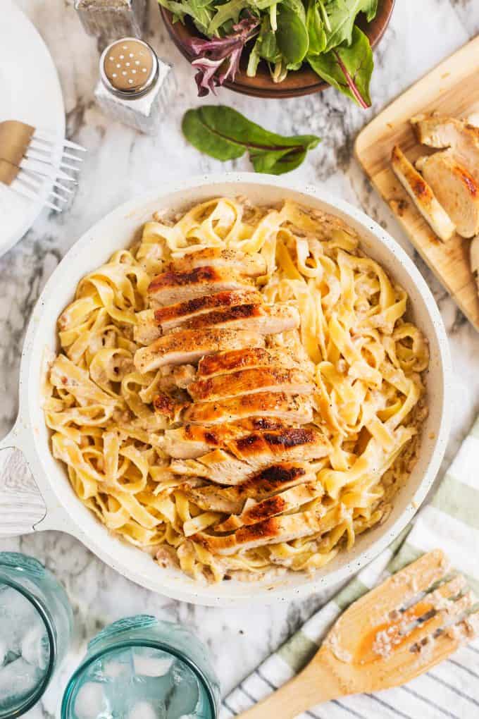 creamy chicken tagliatelle in a white pan