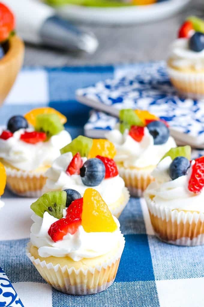 mini cheesecakes topped with fruit