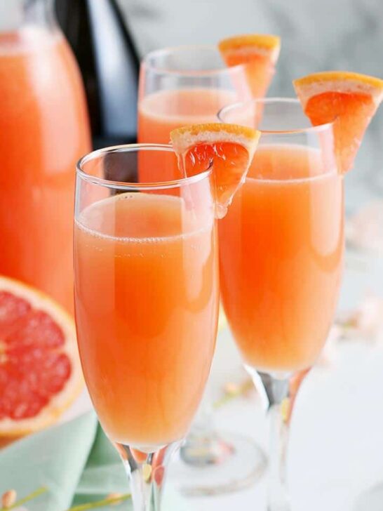 forward facing photo of grapefruit mimosas garnished with fresh grapefruit