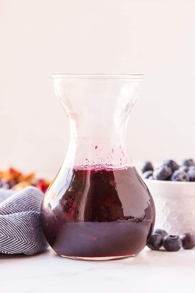 glass jar of delicious blueberry syrup