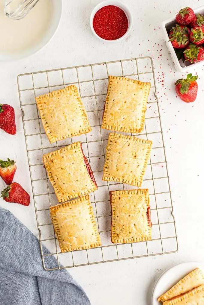 homemade strawberry poptarts fresh out of the oven on a cooling rack