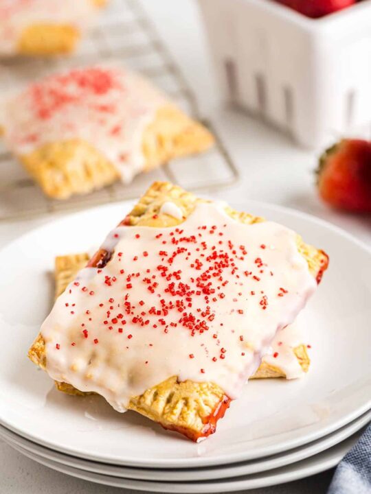 two strawberry pop tarts on a white plate