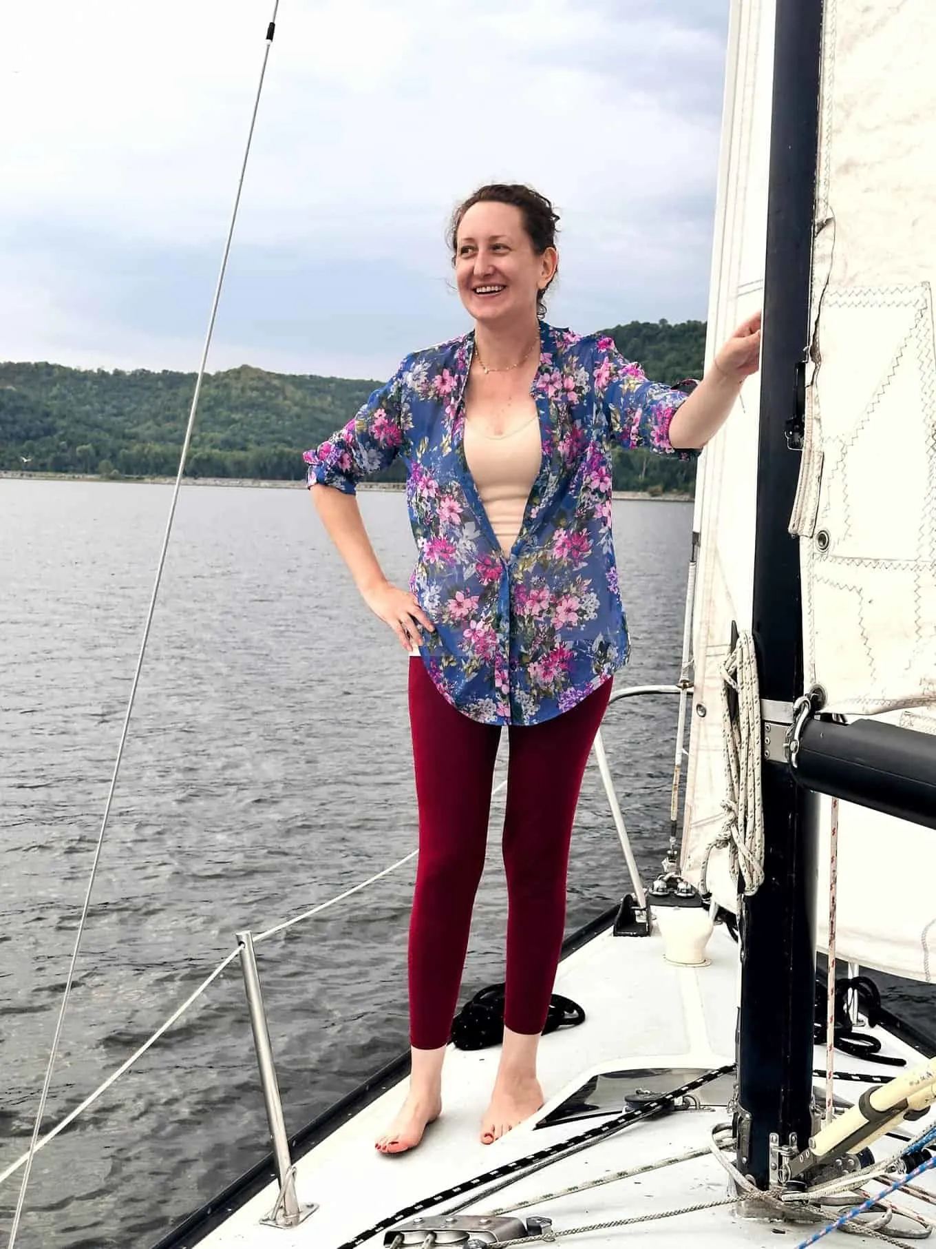 a picture of Jenny on a sail boat on an overcast day