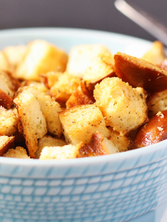 golden brown croutons in a blue bowl