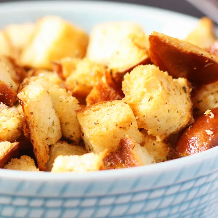 golden brown croutons in a blue bowl