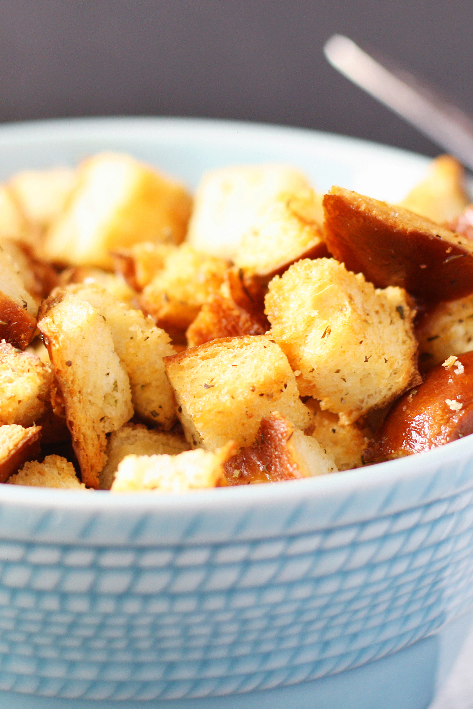 golden brown croutons in a blue bowl