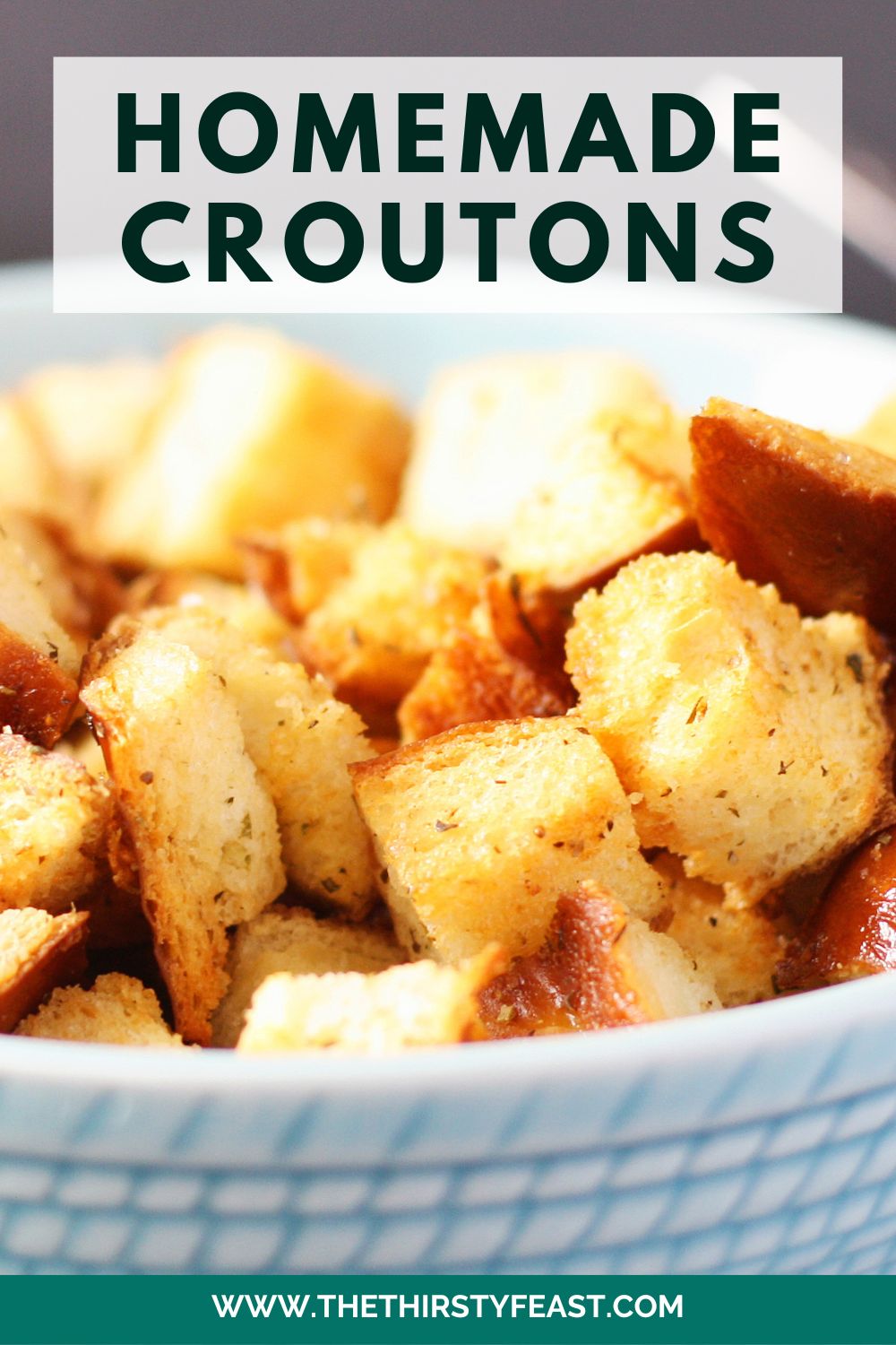 closeup image of crunchy homemade croutons for pinterest. Overlayed is text captioned "homemade croutons"