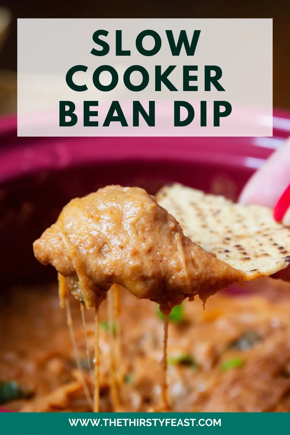 pinterest image for slow cooker bean dip. The chessy bean dip is center stage on a tortilla chip.