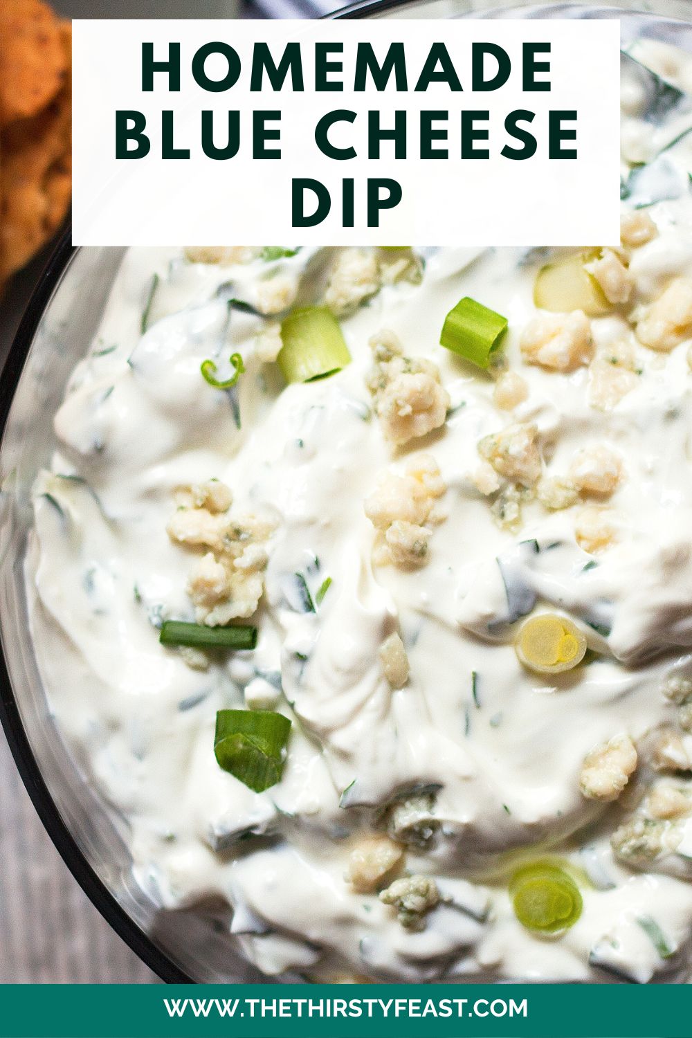 homemade blue cheese dip pinterest image. the bowl of blue cheese dip is zoomed in with a text caption at the top reading "homemade blue cheese dip"