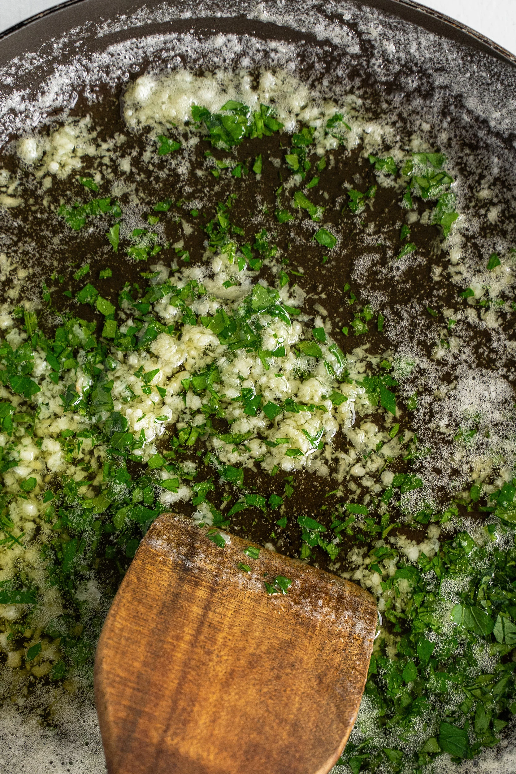 minced garlic and chopped parsley mixed in with melted butter