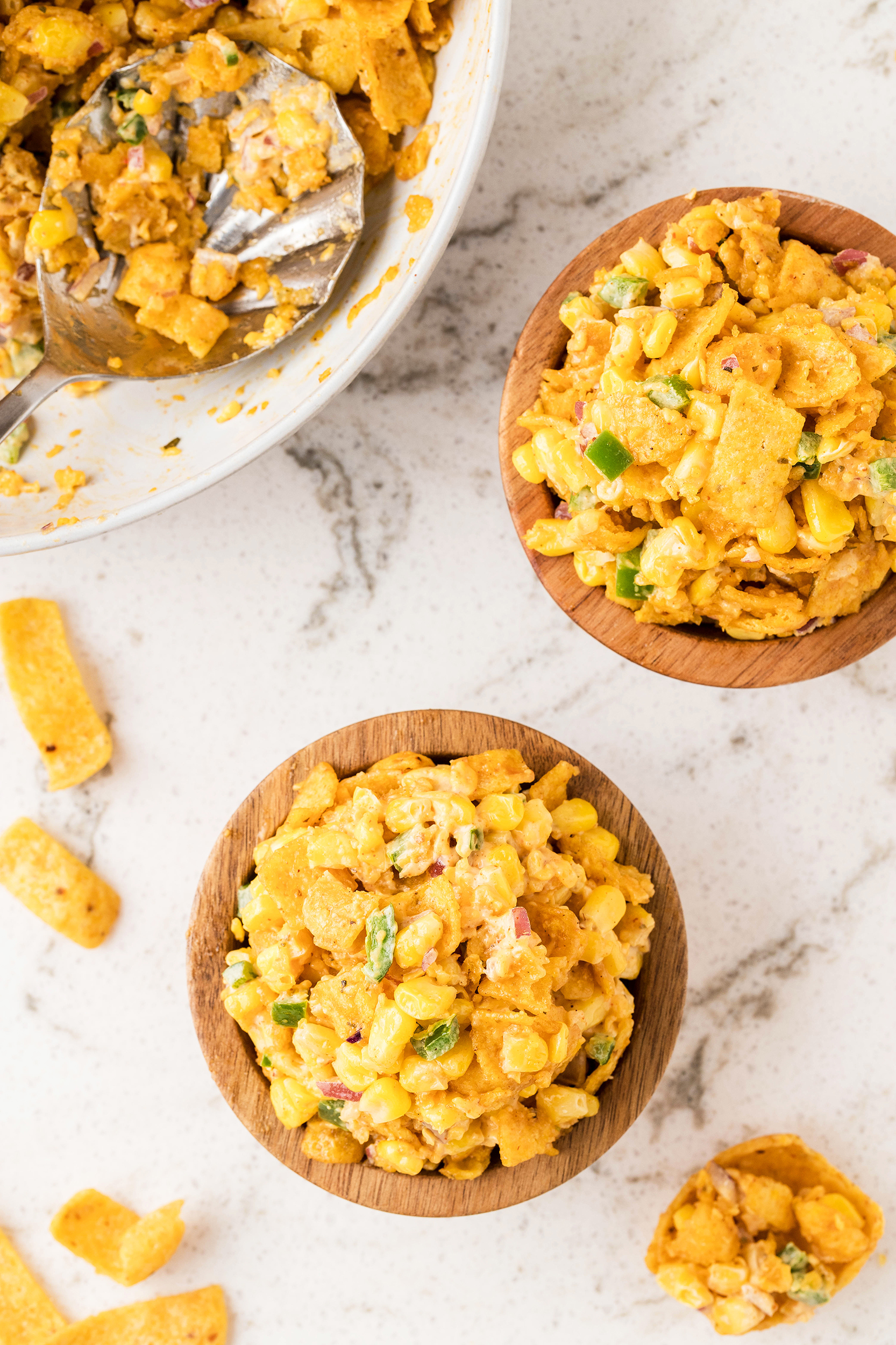 two individual servings of frito corn salad