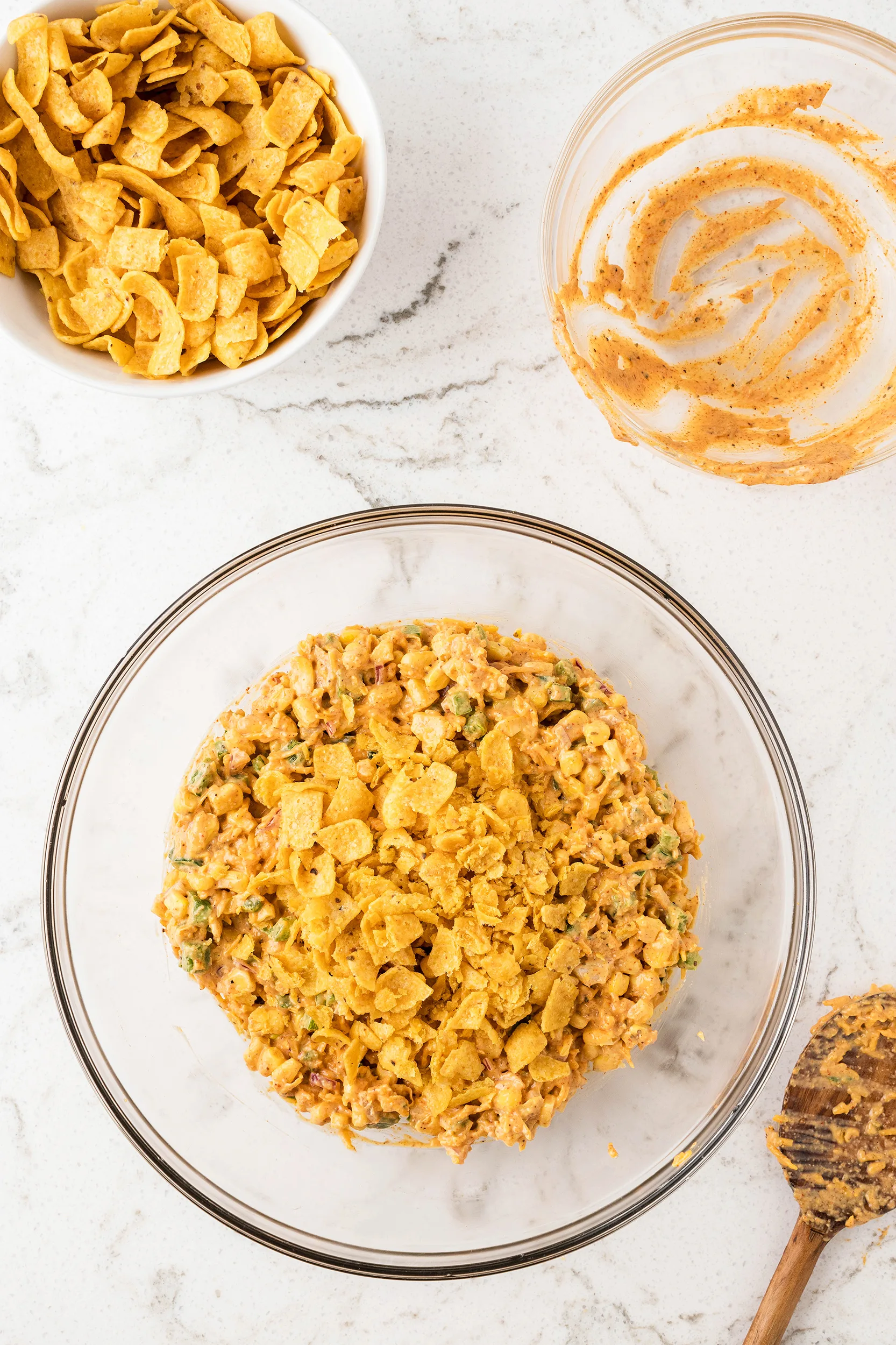 easy frito corn salad recipe with the corn chips about to be mixed in