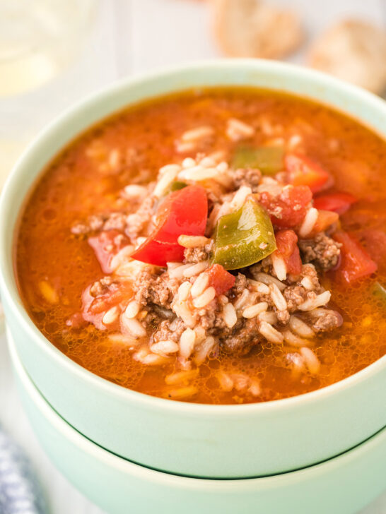 two stacked mint green bowls bowls filled with stuffed pepper soup