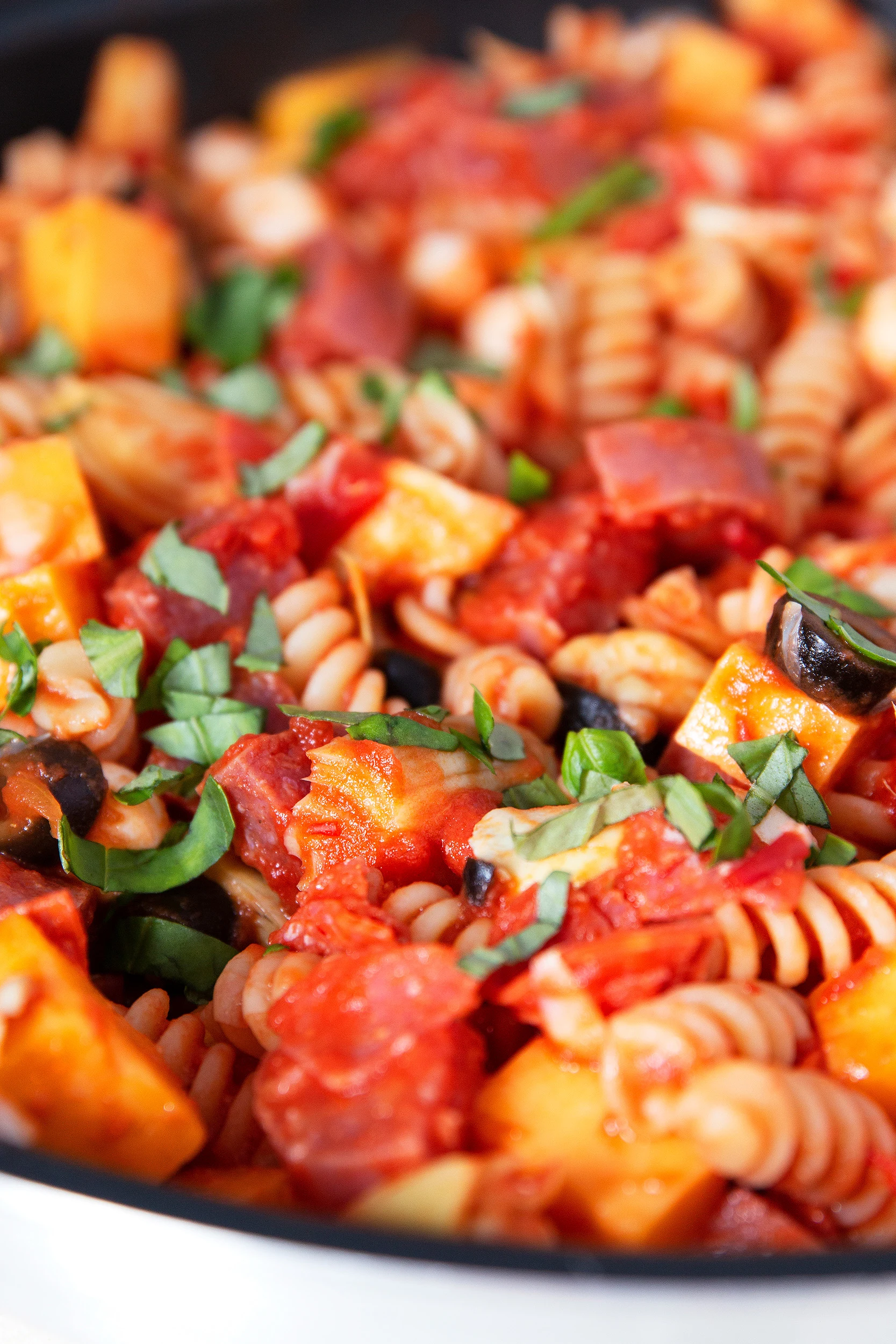 closeup of antipasto pasta skillet recipe cooking in a white skillet