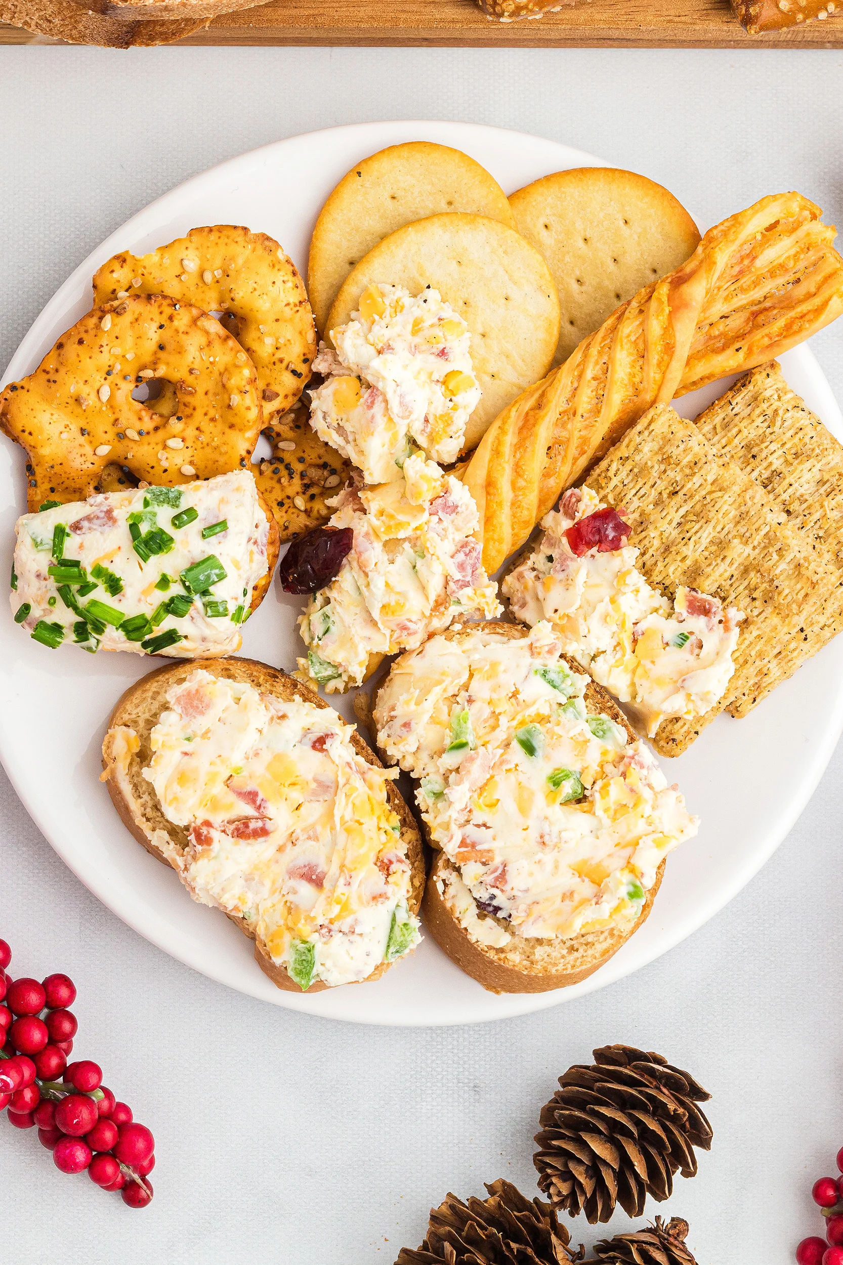 Closeup photo of plate of different crackers covered in the cheese ball mixture