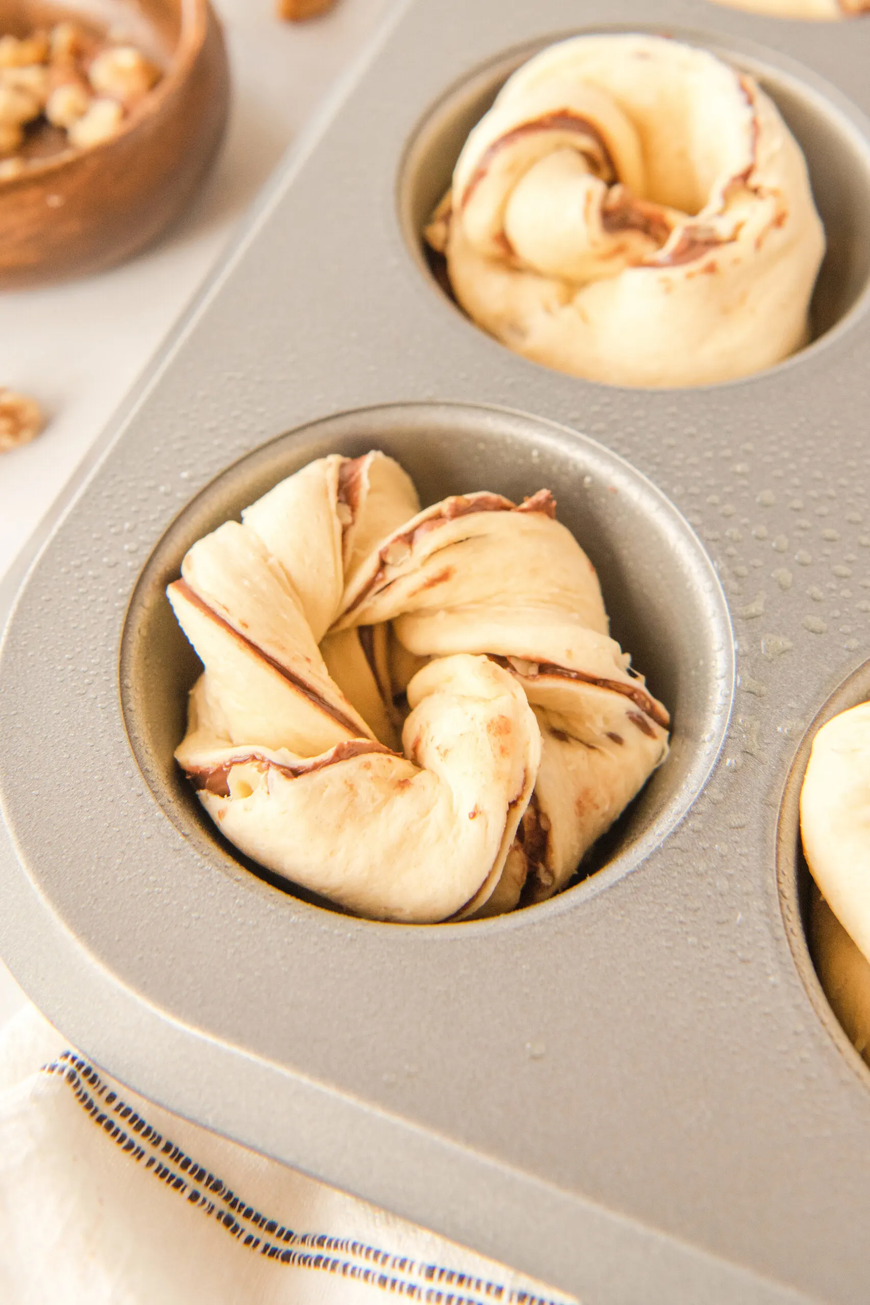 crescent roll twists in a greased muffin tin