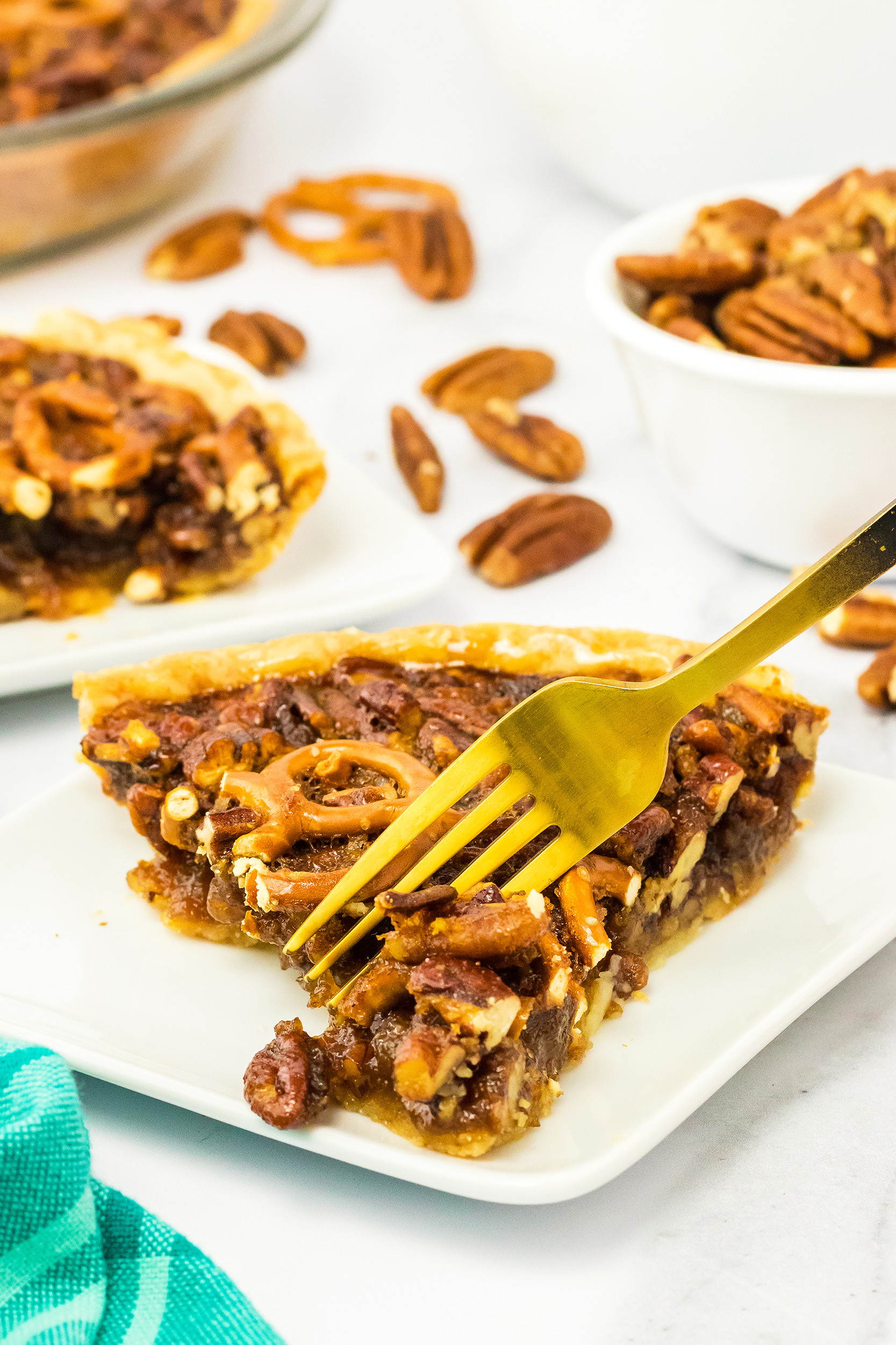 gold fork being used to cut a bite of pie