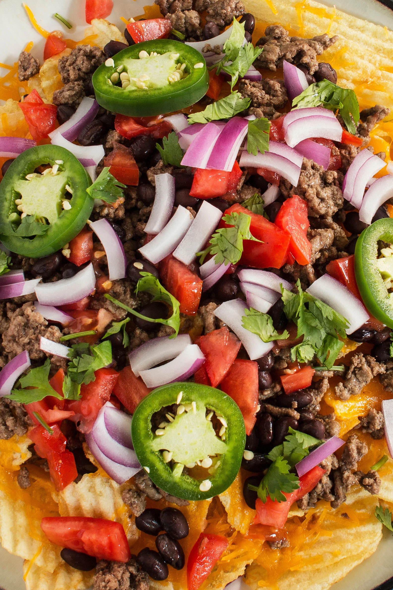 closeup photo of ridged potato chip nachos