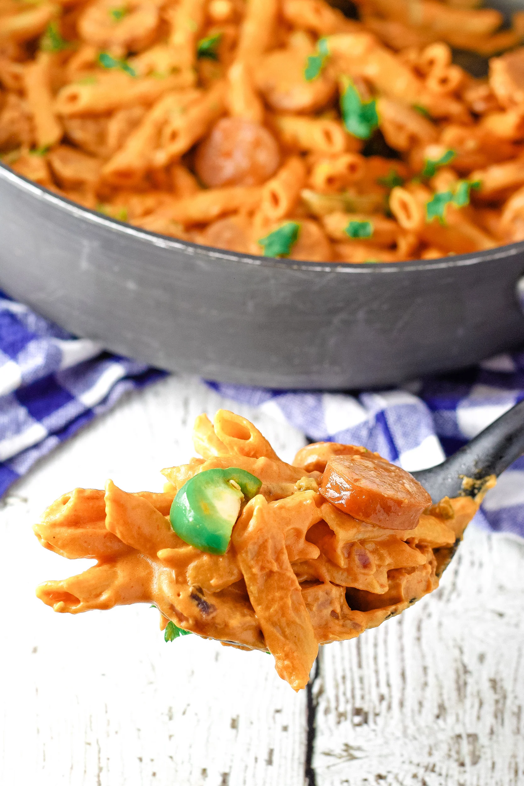 spoonful of cooked one-pot spicy sausage pasta recipe