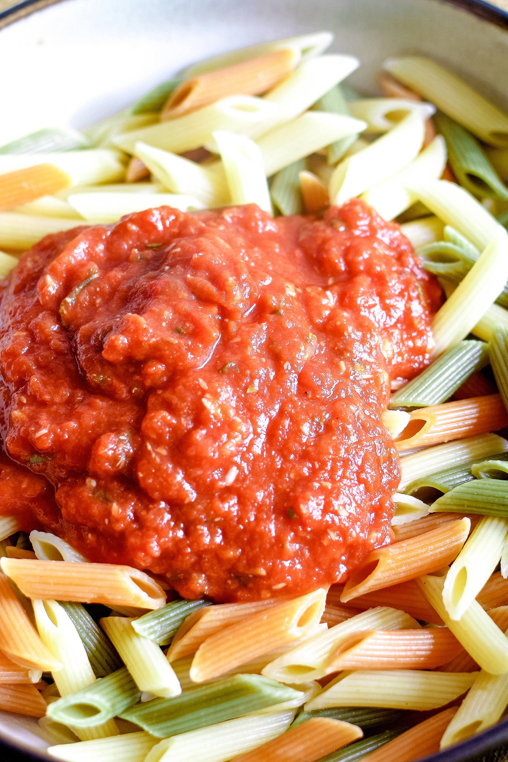 roasted garlic tomato sauce on top of cooked pasta