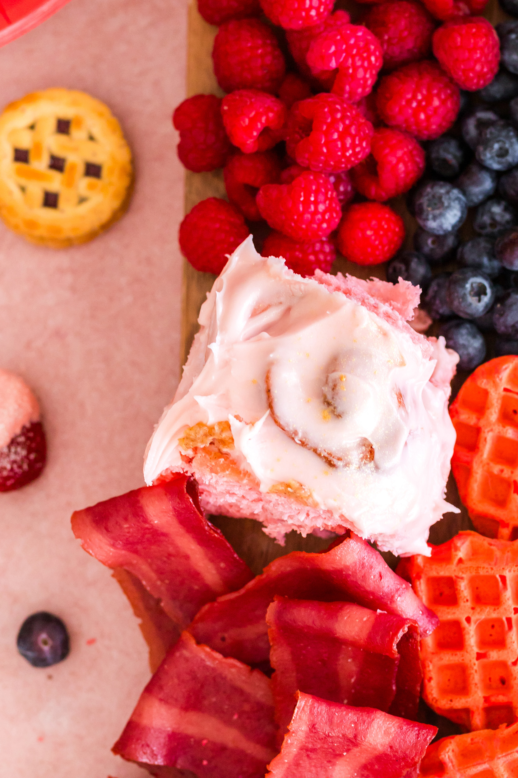 strawberry cinnamon roll frosted with homemade strawberry cream cheese filling