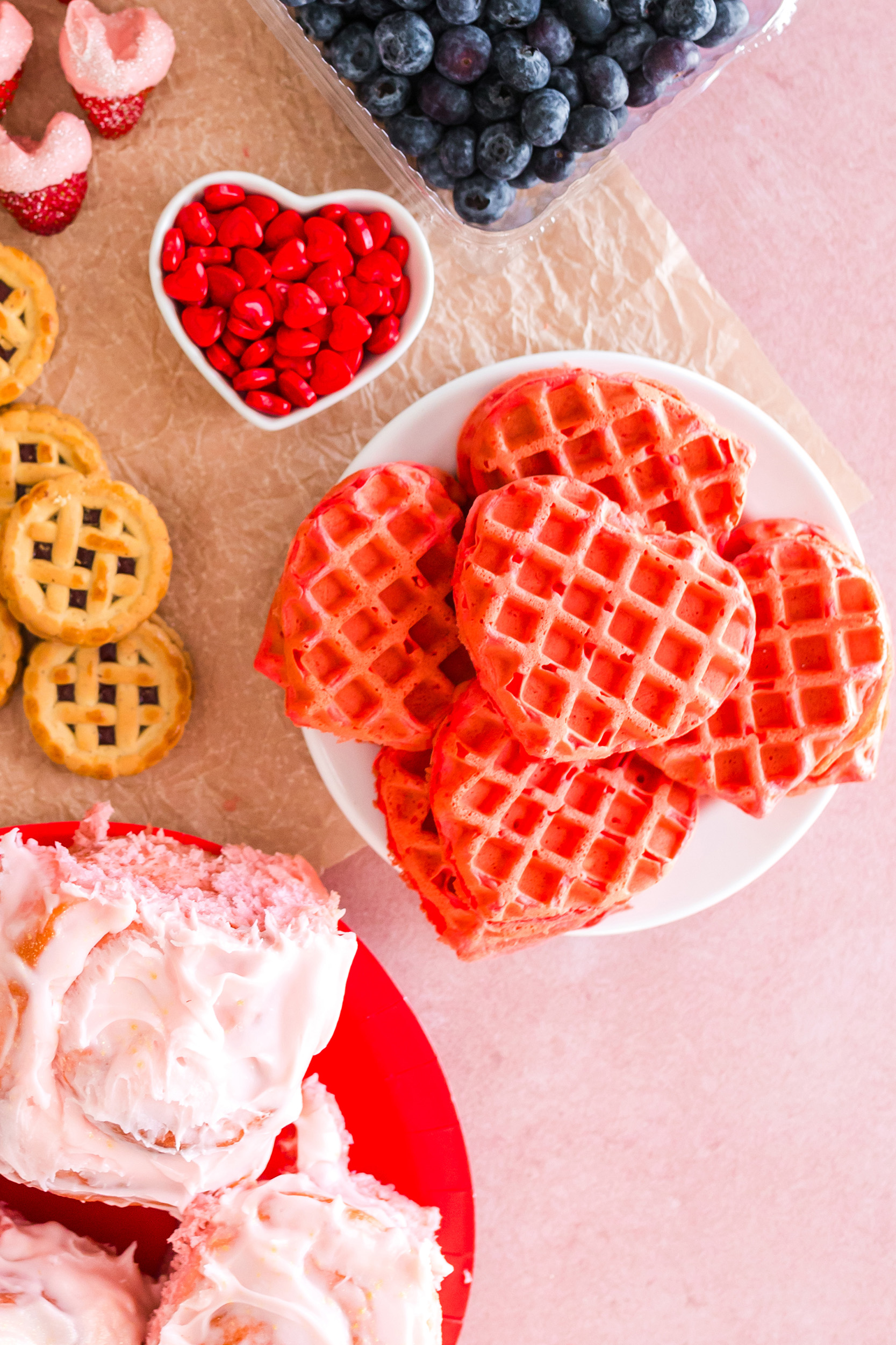 plate of heart-shaped strawberry waffles