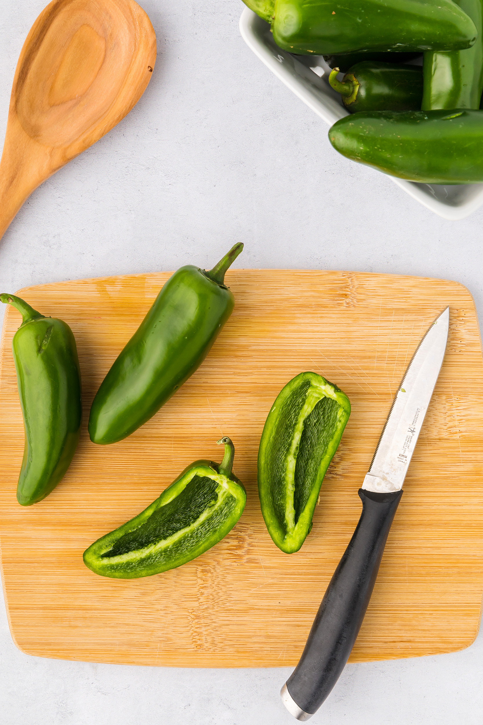 fresh jalapeño peppers sliced in half and deseeded