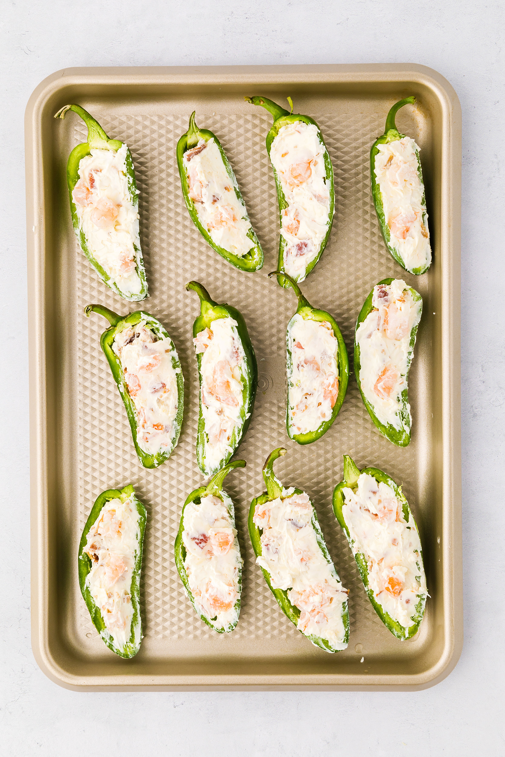 jalapeño halves stuffed with shrimp and cheese mixture