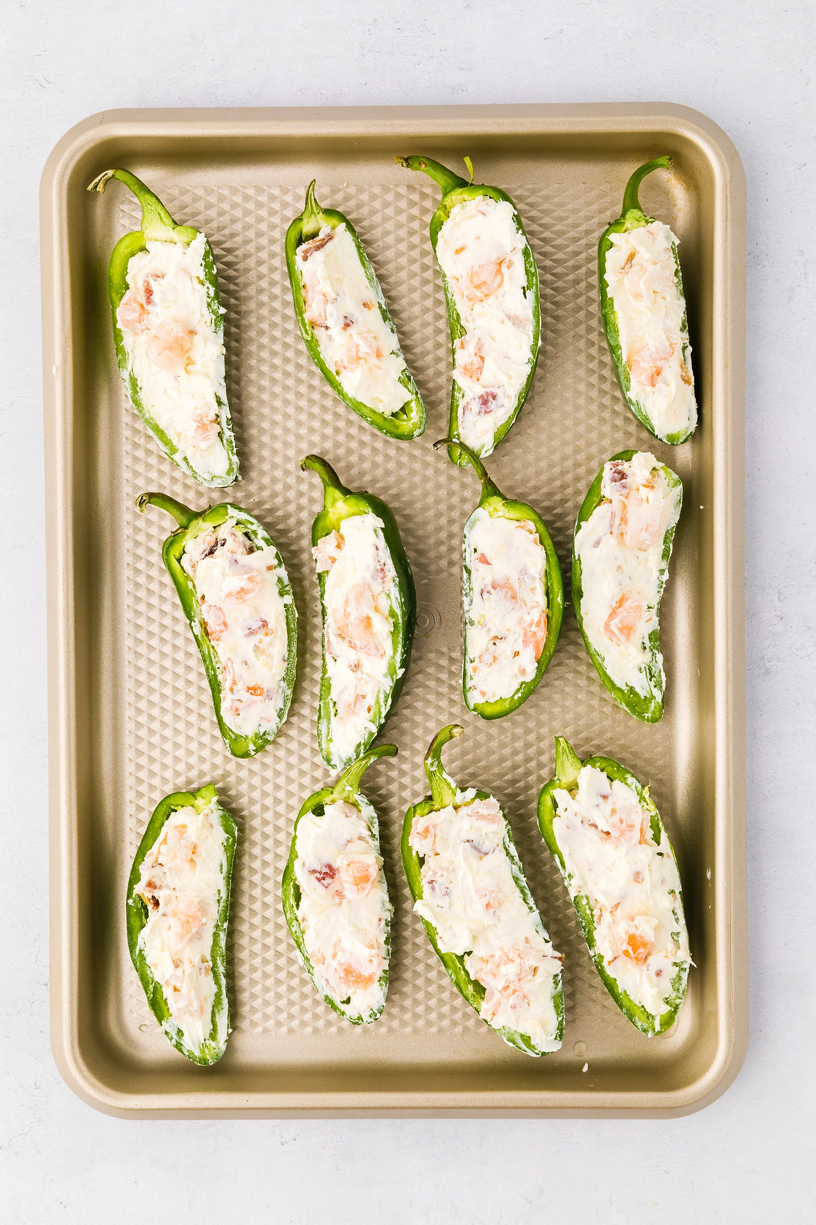 jalapeño halves stuffed with shrimp and cheese mixture